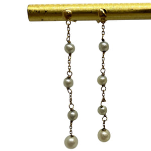 Boucles d'oreilles pendantes en or et perles