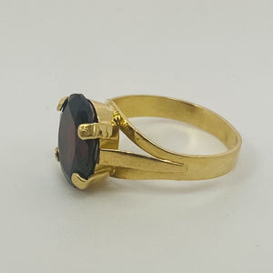 Bague or avec grenat