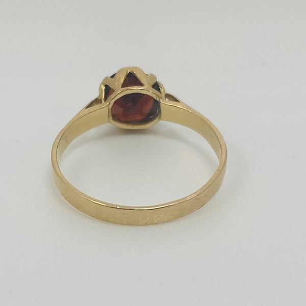 Bague or avec grenat