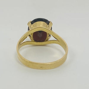 Bague or avec grenat