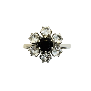 Bague fleur sertie d’un grenat et d’oxydes
