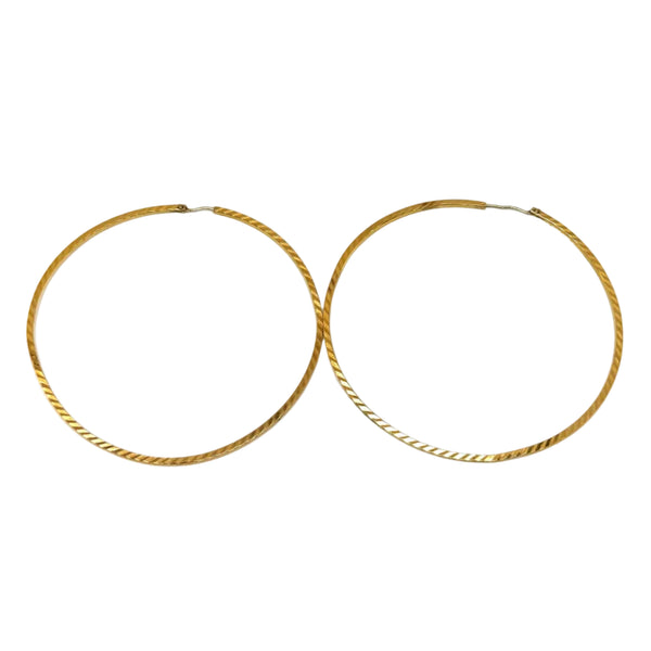 Joli bijou artisanal en or jaune - Boucles demi-créoles