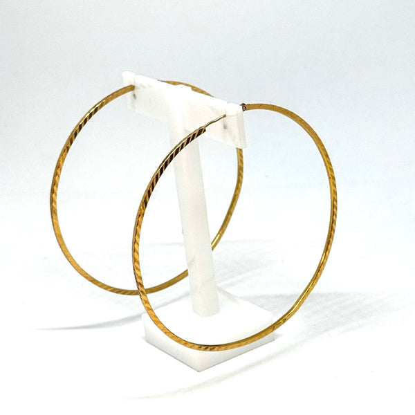 Joli bijou artisanal en or jaune - Boucles demi-créoles
