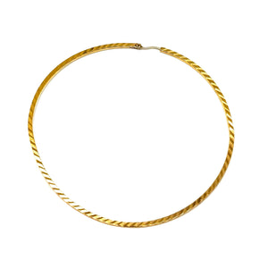 Joli bijou artisanal en or jaune - Boucles demi-créoles