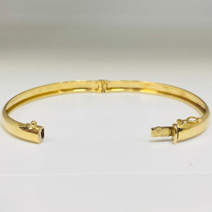 Jonc travaillée en Or jaune 18K Tête d'aigle