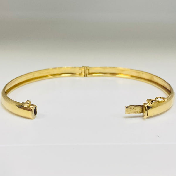 Jonc travaillée en Or jaune 18K Tête d'aigle