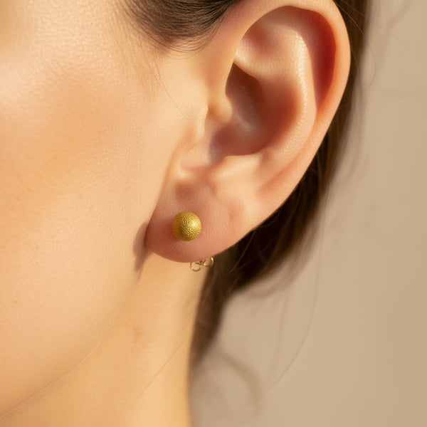 Boucles d'oreilles en or jaune 18k avec poussettes