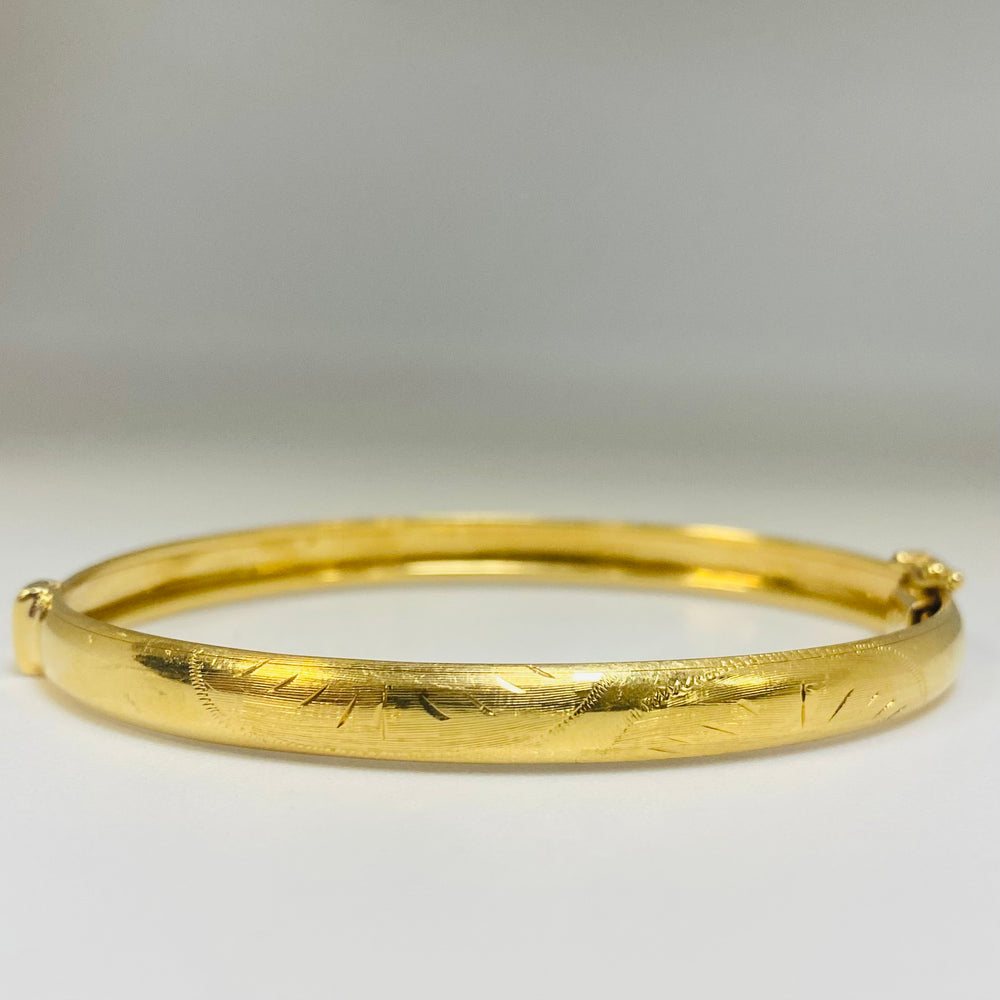 Jonc travaillée en Or jaune 18K Tête d'aigle