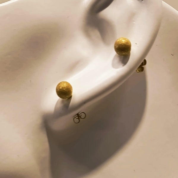 Boucles d'oreilles en or jaune 18k avec poussettes