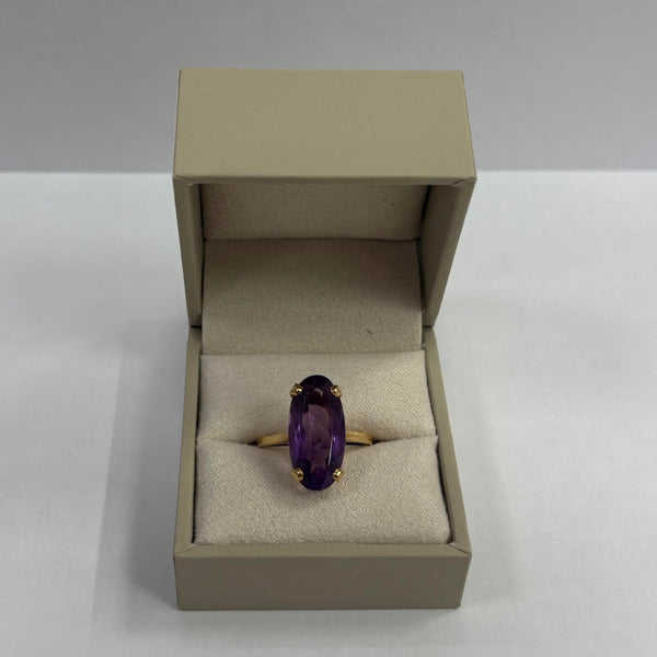 Bague en or jaune 18 carats avec pierre ovale