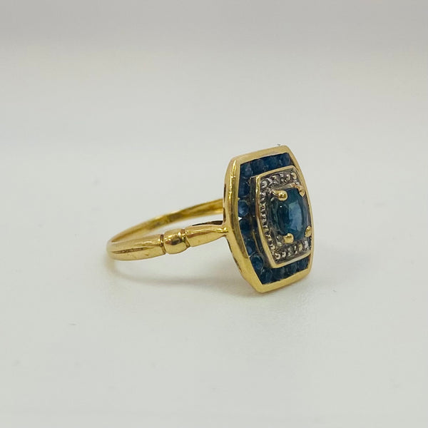 Bague or avec diamants et saphirs