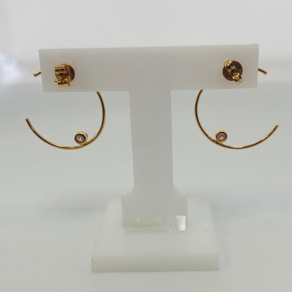 Boucles d'oreilles créoles en or rose avec diamant