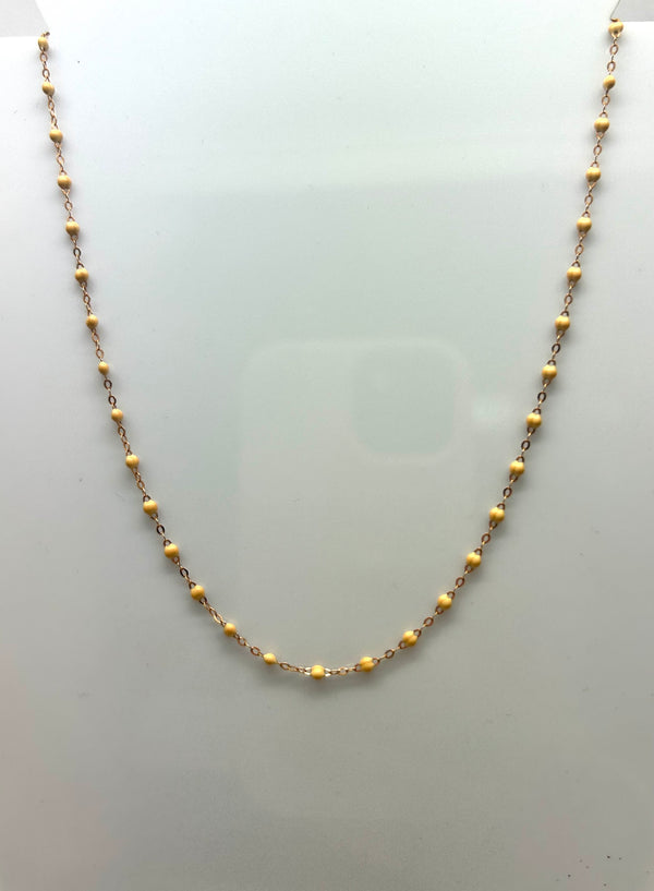 Collier ras du cou perles résine beige or 18 carats