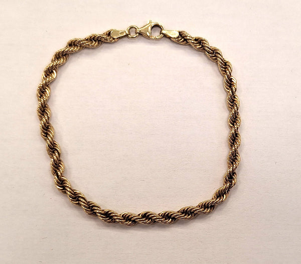 Bracelet en Or jaune 18K torsadé Lg18cm
