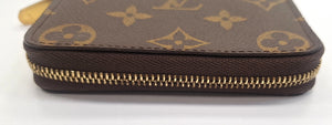 Porte-monnaie Louis Vuitton Zippy en toile monogramme marron
